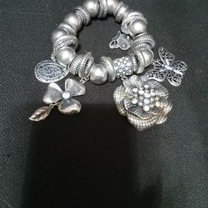 Silvertone bracelet Rose themed
